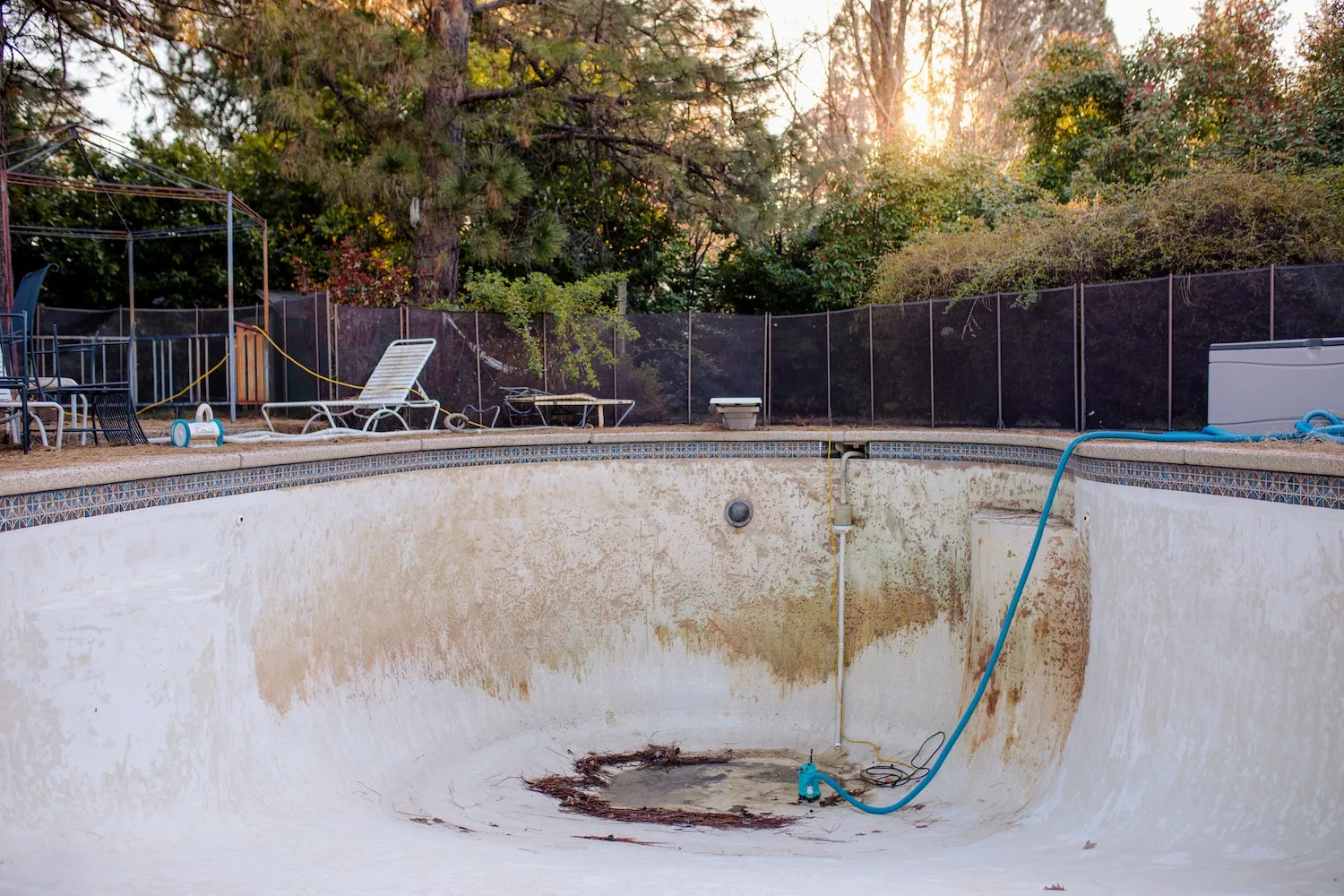 Drained concrete pool ready for closure